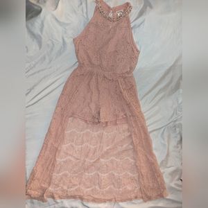 Rose gold tone romper shorts with train.